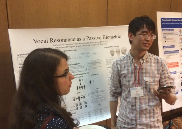 Rui Liu explains his poster to attendees at ACM MobiSys'17.